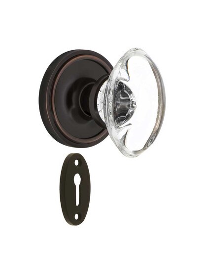 Classic Rosette Mortise-Lock Set with Oval Crystal Glass Knobs in Timeless Bronze.
